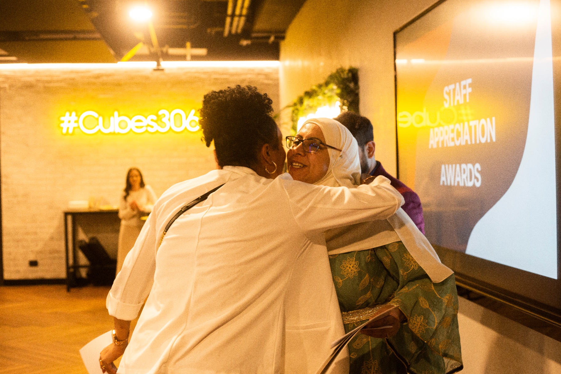 Diverse community members celebrating together at Infinite Support event